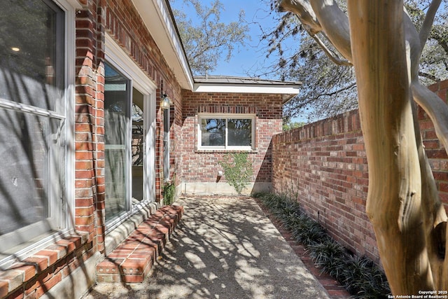 view of patio featuring fence