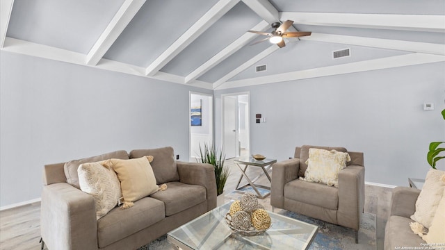 living area featuring a ceiling fan, vaulted ceiling with beams, wood finished floors, and visible vents