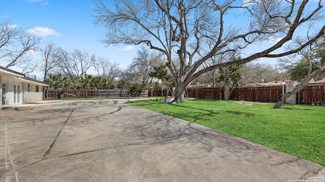 view of yard with a fenced backyard and a patio area