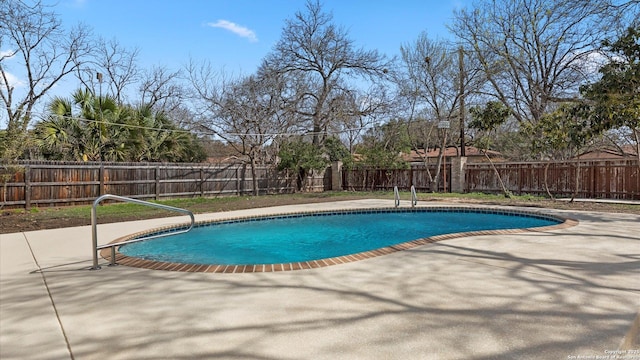 view of pool featuring a patio area, a fenced in pool, and a fenced backyard