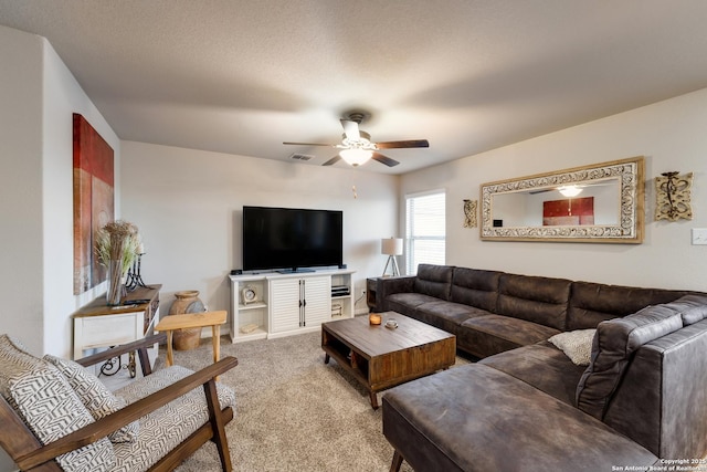 carpeted living room with a ceiling fan and visible vents