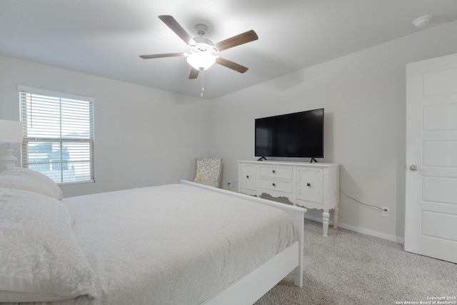 bedroom with baseboards, light carpet, and ceiling fan