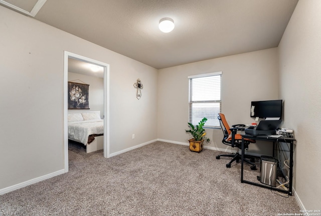 home office with baseboards and carpet floors