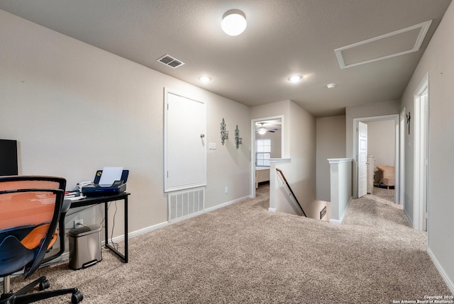 office space featuring visible vents, baseboards, and carpet floors