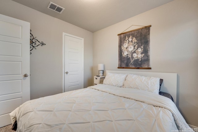 bedroom featuring visible vents