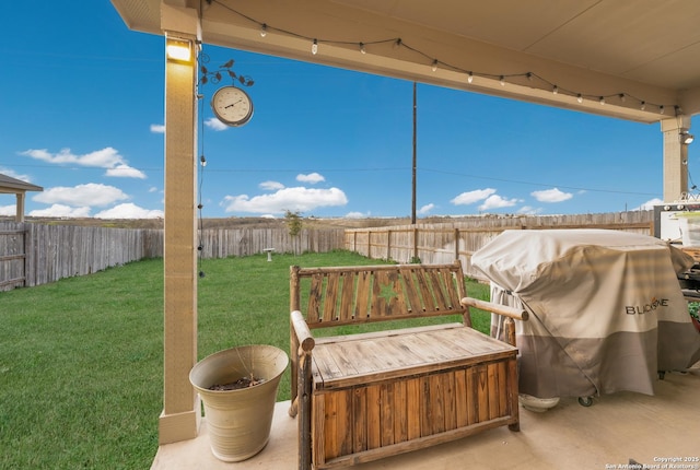 view of patio / terrace with a fenced backyard and a grill