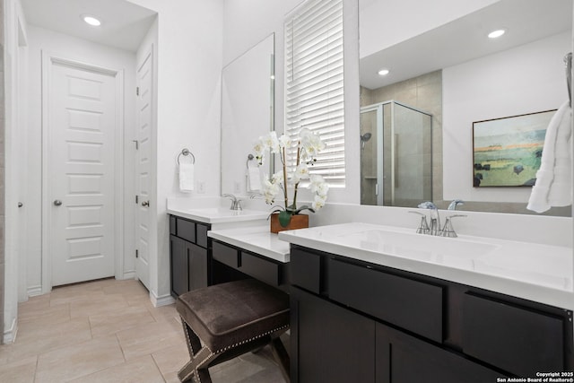 full bathroom featuring recessed lighting, vanity, and a shower stall