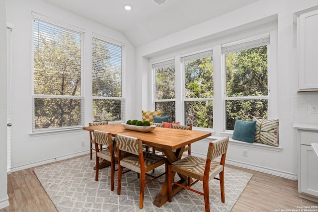 sunroom / solarium featuring lofted ceiling