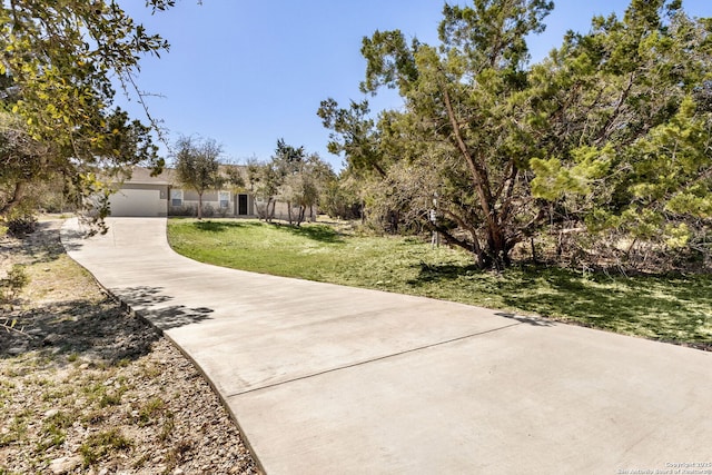 exterior space with a garage and concrete driveway