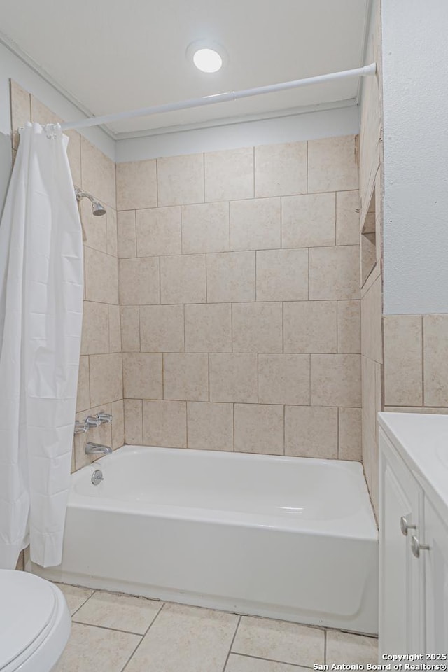 full bathroom with tile patterned floors, shower / bathtub combination with curtain, toilet, and vanity