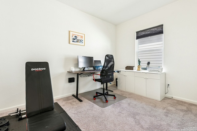 office area featuring light colored carpet and baseboards