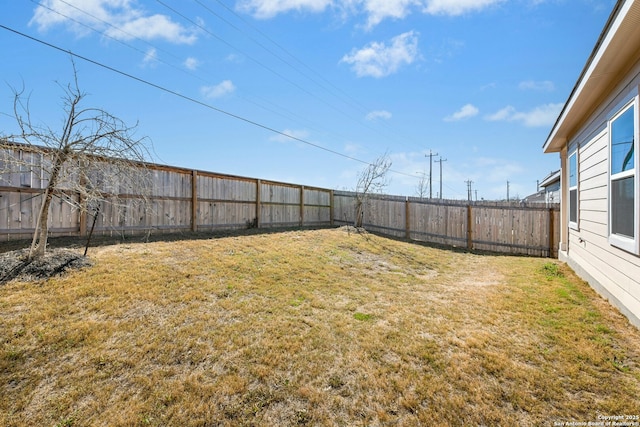 view of yard with a fenced backyard