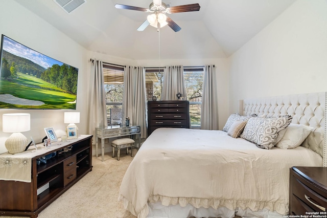 bedroom featuring visible vents, light carpet, a ceiling fan, and vaulted ceiling