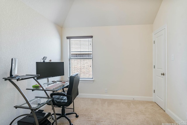 home office featuring baseboards, carpet flooring, and vaulted ceiling