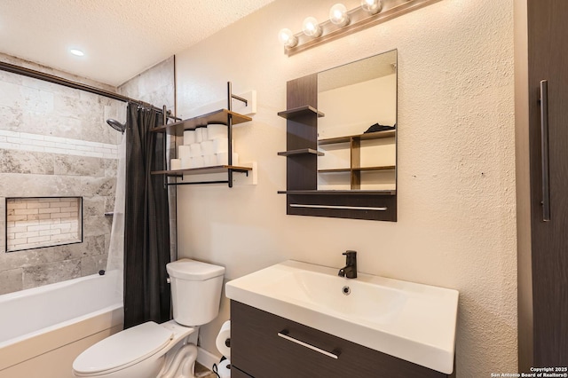 full bath with vanity, a textured ceiling, toilet, a textured wall, and shower / tub combo with curtain