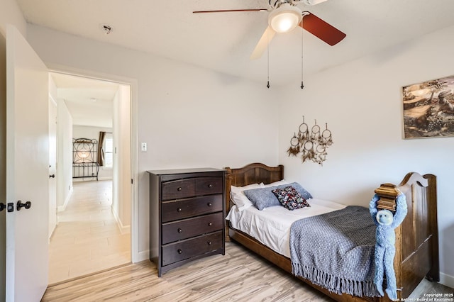 bedroom featuring ceiling fan and light wood finished floors