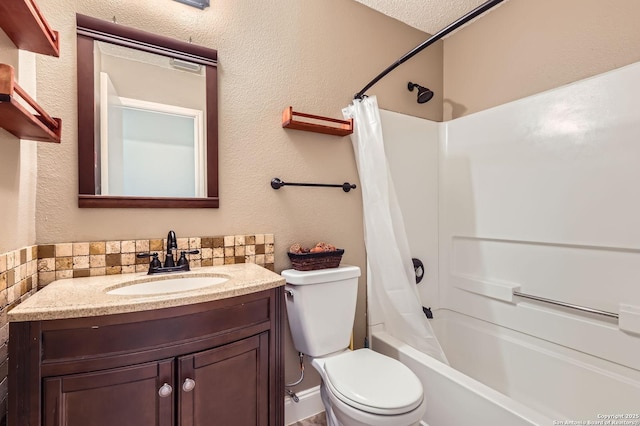 full bath featuring backsplash, toilet, shower / tub combo with curtain, a textured wall, and vanity