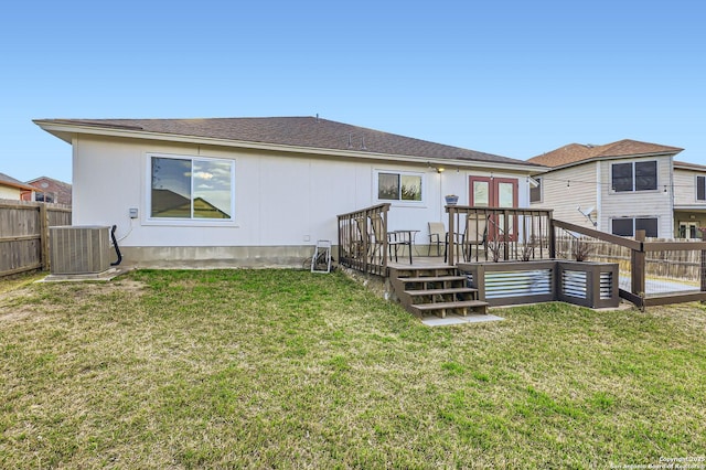 back of house with a yard, central AC, a deck, and fence