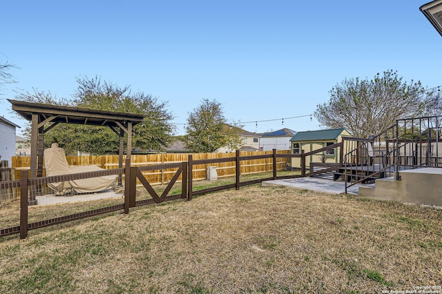 view of yard with a patio area and a fenced backyard