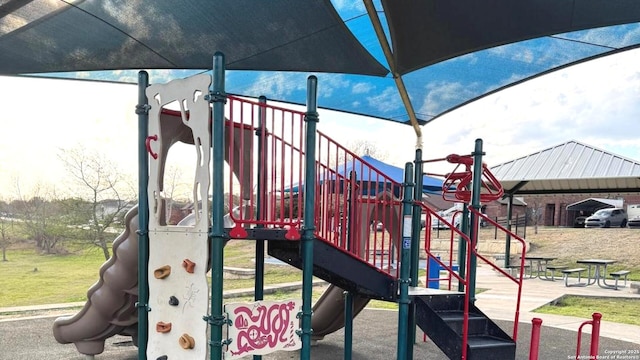 view of jungle gym with a lawn