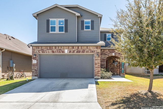 view of front of property with a front lawn, an attached garage, brick siding, and driveway