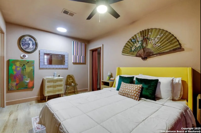 bedroom featuring recessed lighting, wood finished floors, visible vents, and baseboards