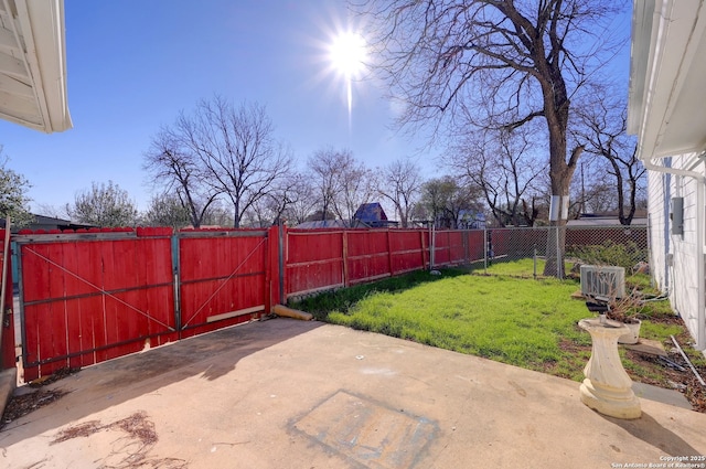 view of patio with a gate and fence