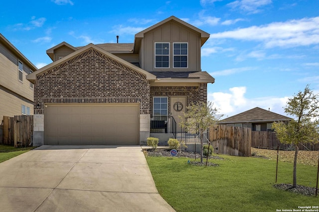 view of front of home with a front yard, an attached garage, fence, and board and batten siding