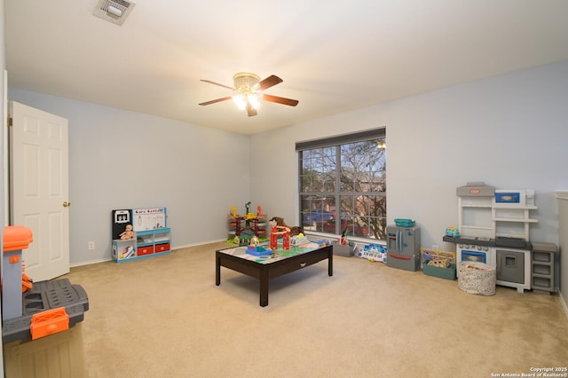 recreation room with visible vents, carpet floors, and ceiling fan