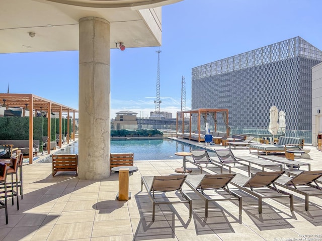 view of swimming pool with a patio