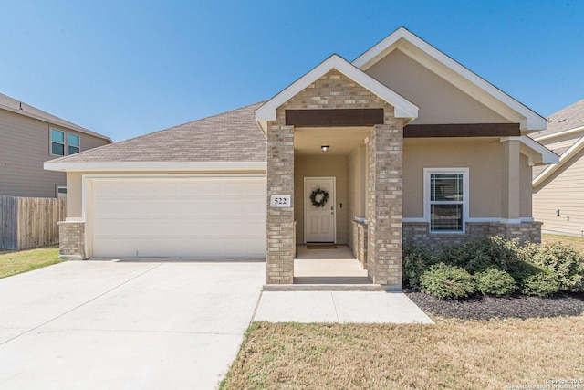 craftsman inspired home featuring stucco siding, driveway, fence, an attached garage, and a shingled roof