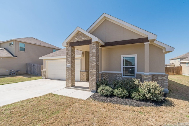 craftsman house with a front lawn, fence, stucco siding, a garage, and driveway