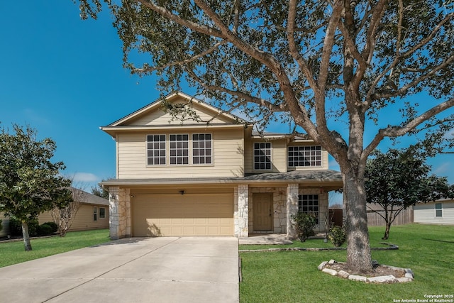 traditional home with fence, a front lawn, concrete driveway, a garage, and stone siding