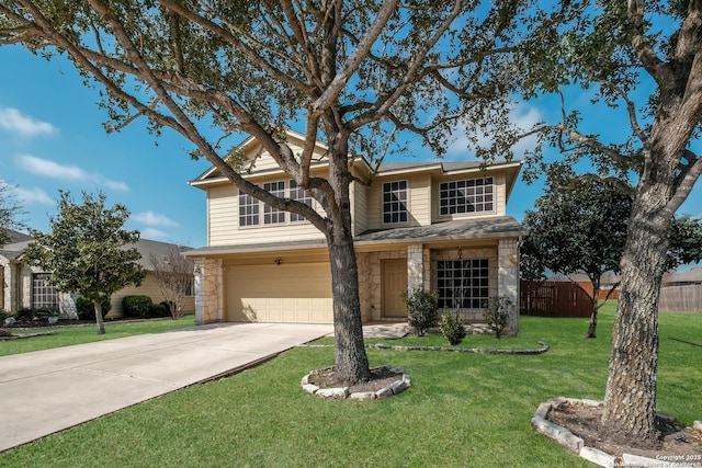 traditional home with fence, driveway, a front lawn, a garage, and stone siding