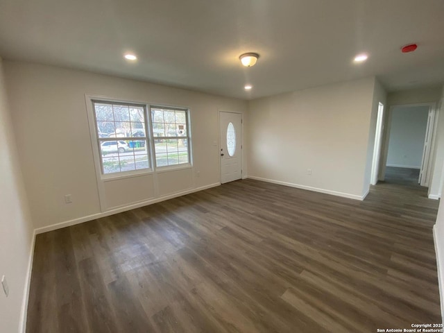 entryway featuring dark wood-style floors, recessed lighting, and baseboards