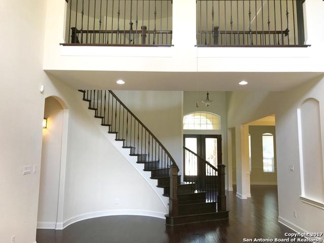 foyer entrance with plenty of natural light and a towering ceiling