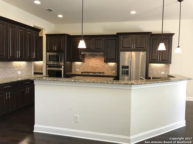 kitchen featuring visible vents, recessed lighting, stone countertops, and stainless steel appliances