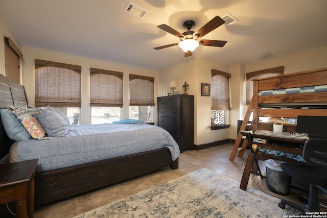 bedroom featuring tile patterned flooring, visible vents, a ceiling fan, and baseboards