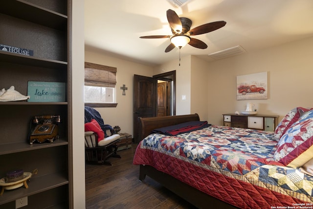 bedroom featuring visible vents, ceiling fan, and wood finished floors