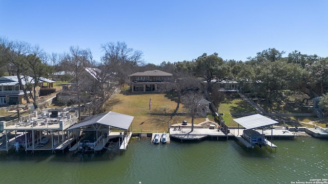 dock area featuring a yard, a water view, and boat lift