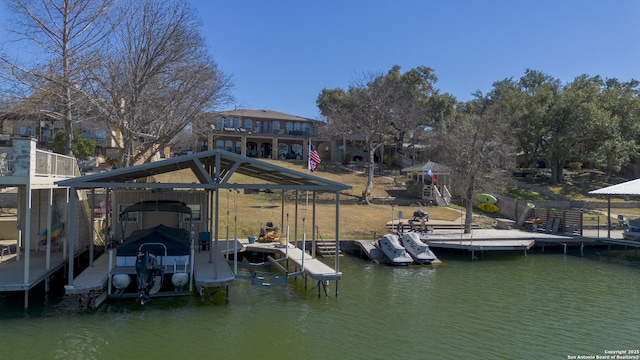 dock area featuring boat lift and a water view