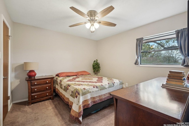 carpeted bedroom with a ceiling fan