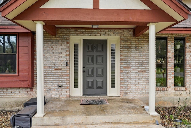 entrance to property with brick siding