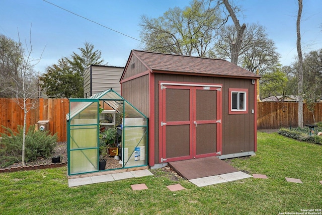 view of outbuilding with an outbuilding and a fenced backyard