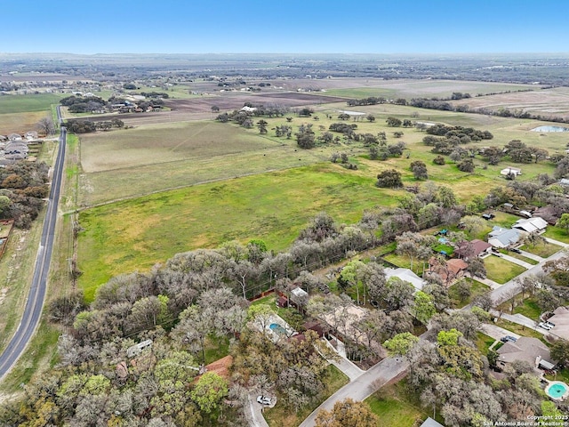 birds eye view of property featuring a rural view