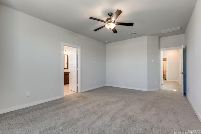 unfurnished bedroom with visible vents, baseboards, and light colored carpet