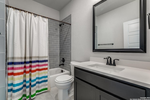 full bathroom with tile patterned floors, shower / tub combo, toilet, and vanity