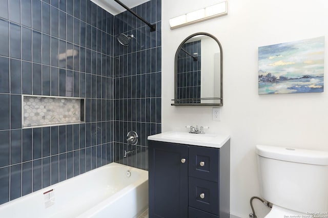 bathroom featuring vanity, toilet, and shower / bathtub combination