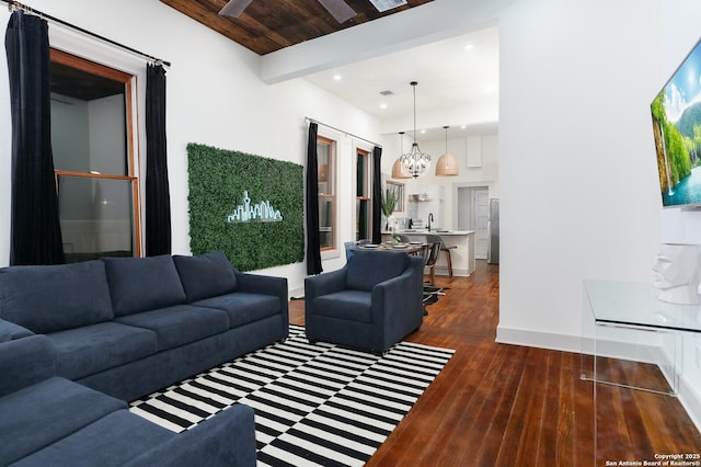 living area featuring baseboards, beamed ceiling, wood ceiling, recessed lighting, and hardwood / wood-style flooring