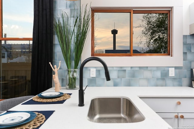 details featuring light countertops and a sink